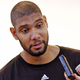An "agitated" Duncan responds to reporters' questions in a brusque tone of voice at a slightly elevated volume.